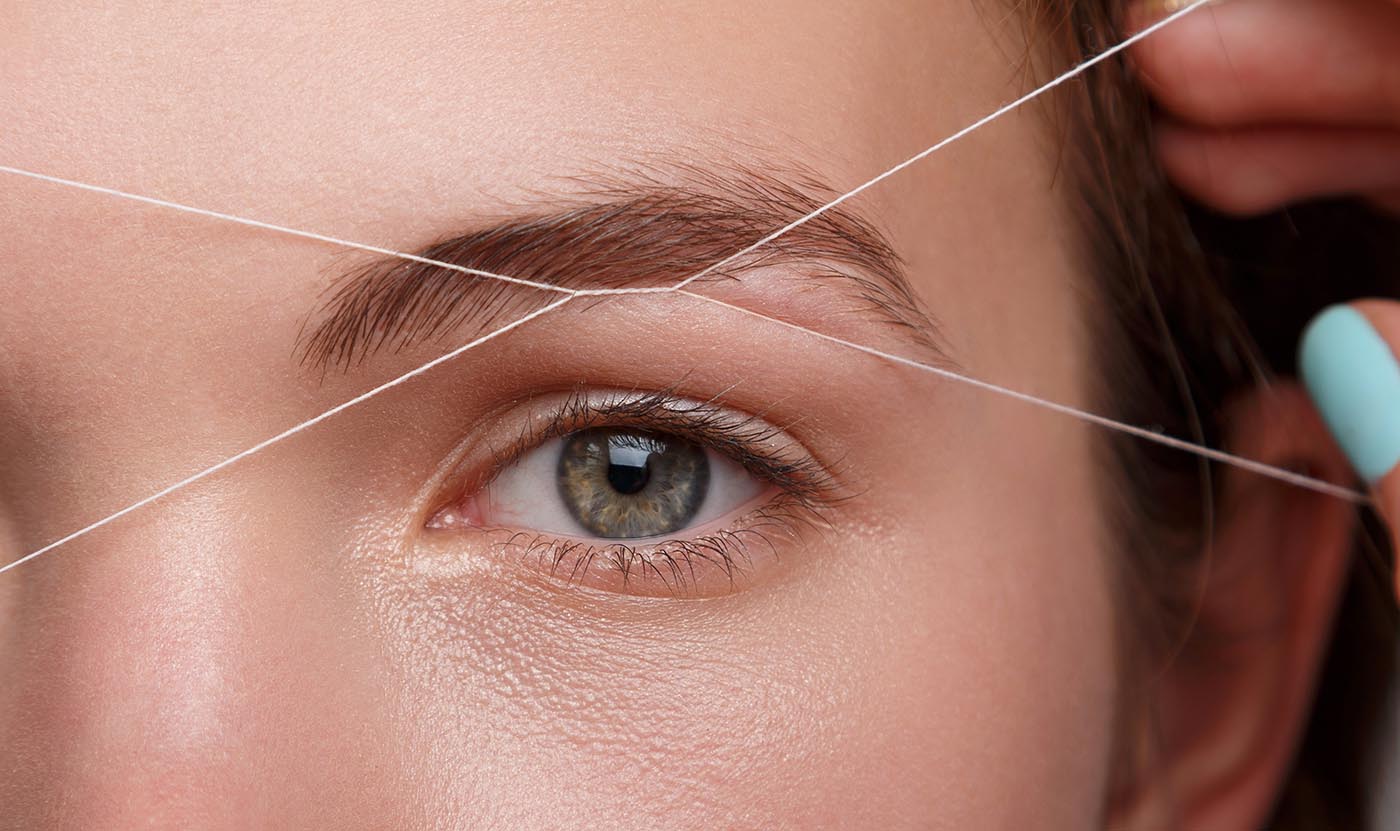 Eyebrow correction with a white thread
